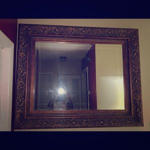 Brown and gold brass mirror